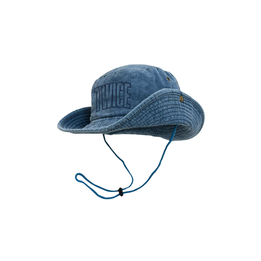 Denim bucket hat with snap buttons on the side and chin strap with cord lock. TWICE logo embroidered in navy blue on the front.